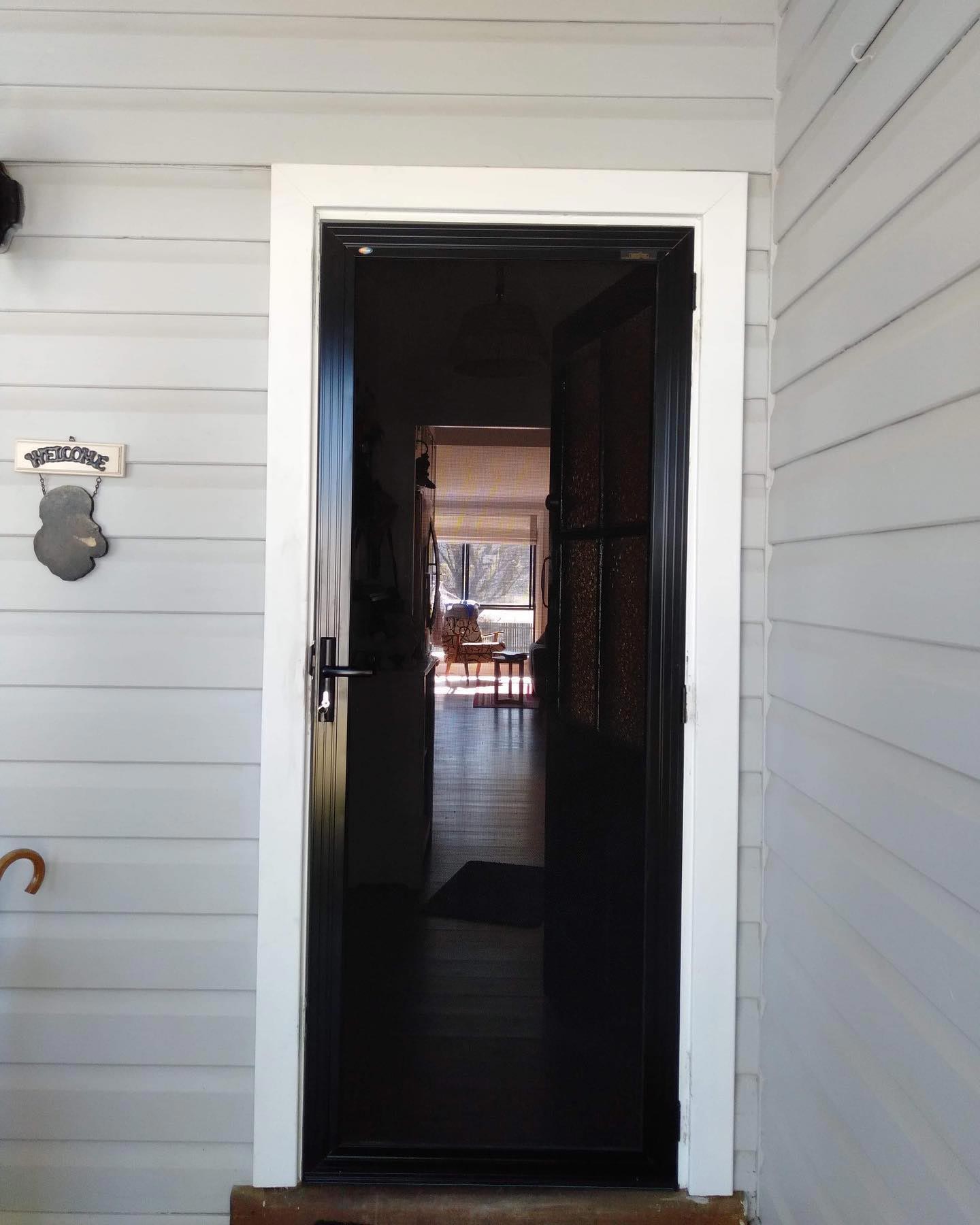 A Security Door On The Front Door Of A House