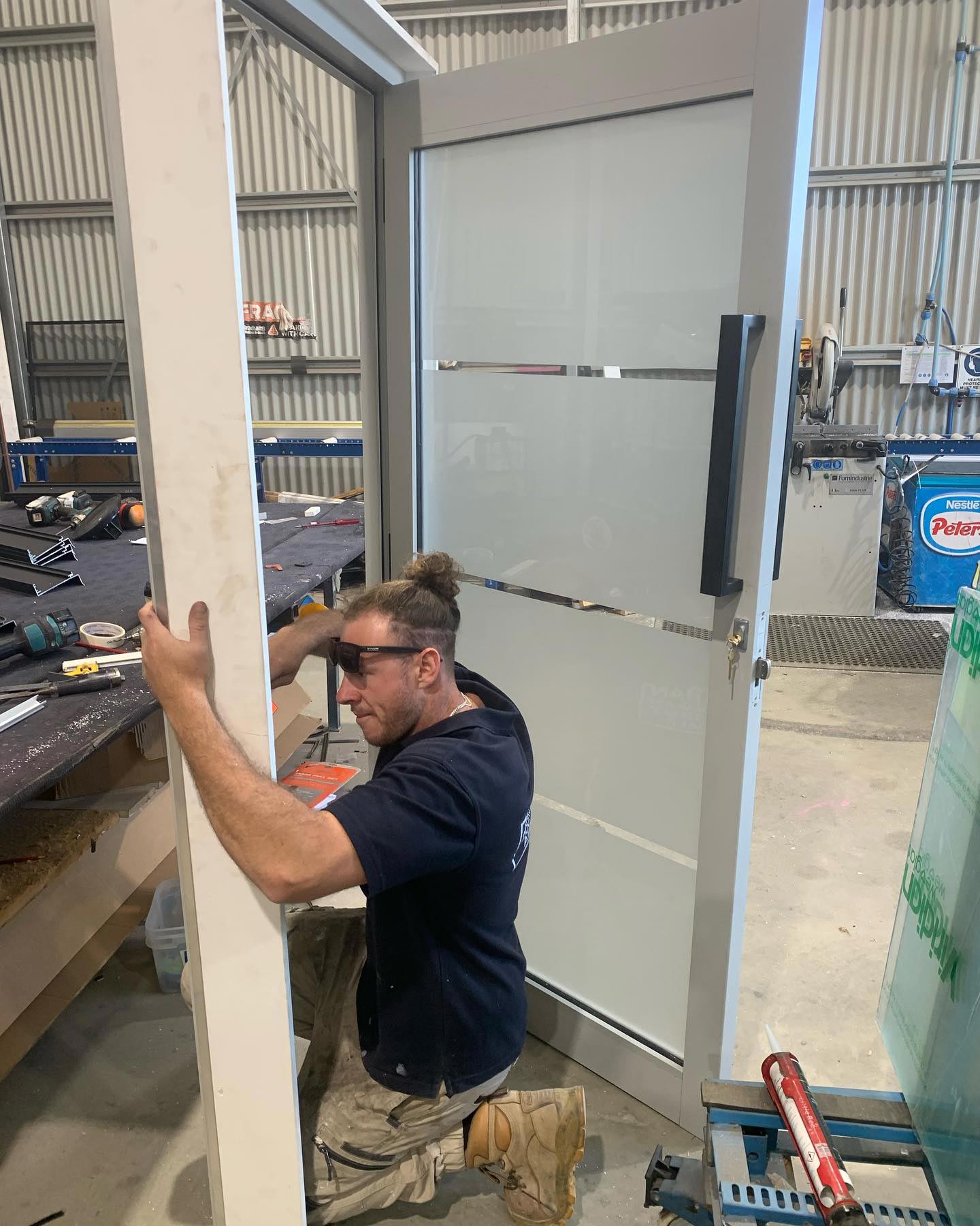 Man Assembling An Aluminium Door