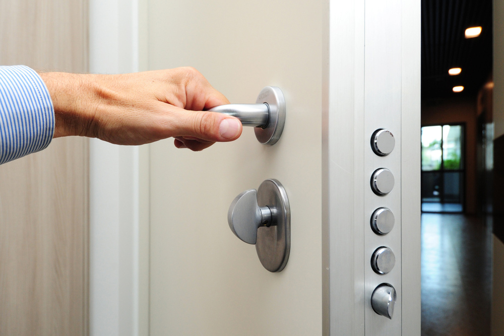 Hand Opening a Fire-Rated Steel Door